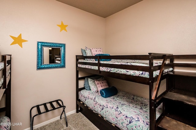 bedroom featuring baseboards and carpet flooring