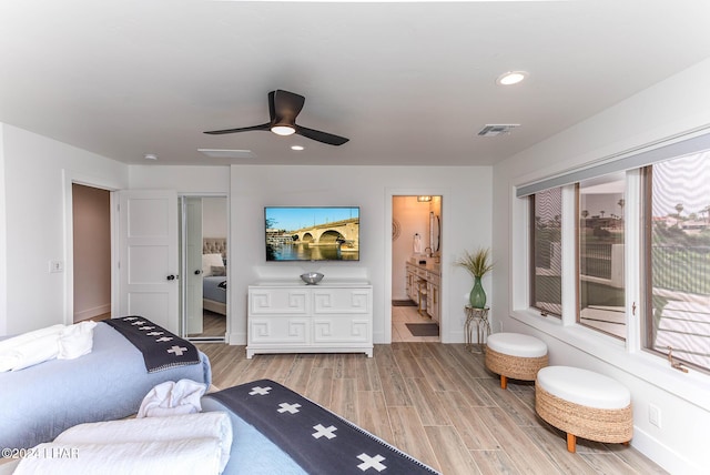 bedroom featuring a ceiling fan, visible vents, baseboards, light wood-style flooring, and recessed lighting