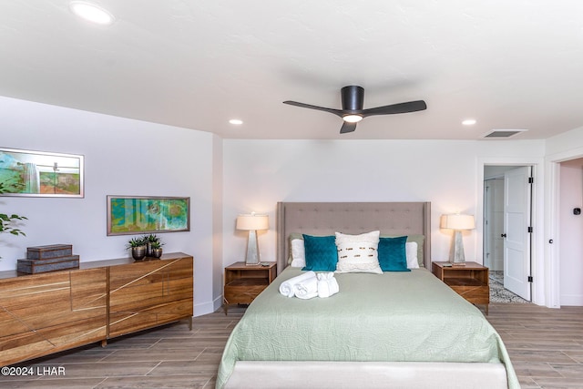 bedroom featuring visible vents, recessed lighting, a ceiling fan, and wood tiled floor