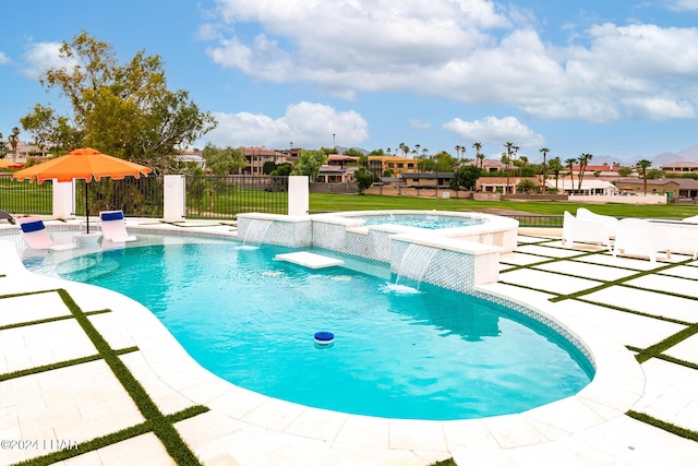 view of swimming pool with an in ground hot tub, fence, a fenced in pool, and a patio area