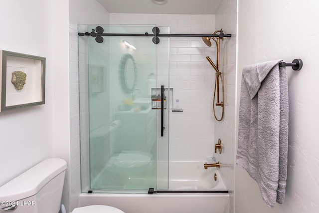 full bathroom with toilet and shower / bath combination with glass door