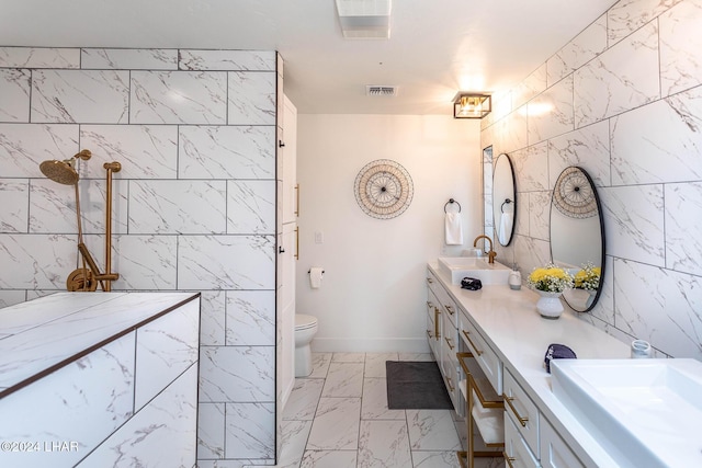 full bathroom featuring visible vents, marble finish floor, a sink, double vanity, and walk in shower