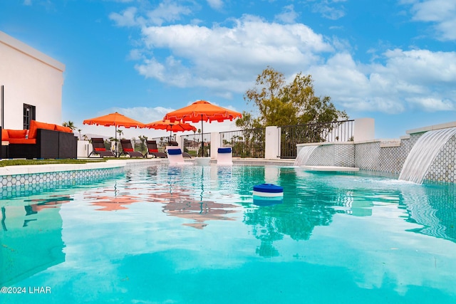 view of pool featuring a fenced in pool and fence