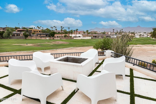 view of patio featuring a mountain view and a fire pit