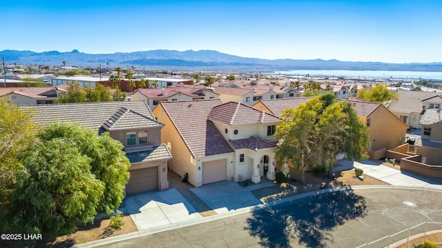 aerial view featuring a mountain view and a residential view