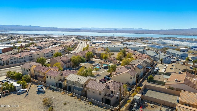 bird's eye view featuring a residential view and a water and mountain view