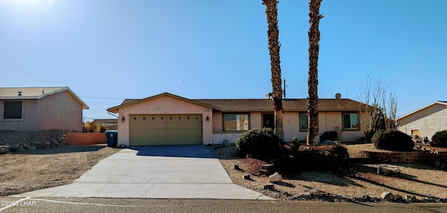 single story home featuring a garage