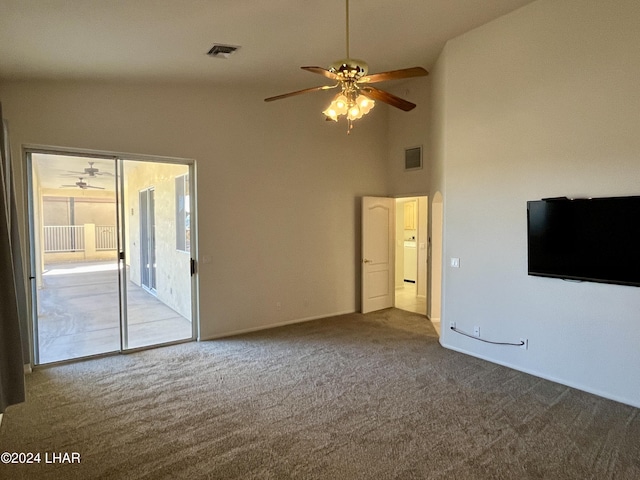 unfurnished living room with high vaulted ceiling, carpet floors, and ceiling fan