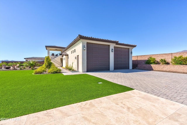 garage featuring decorative driveway