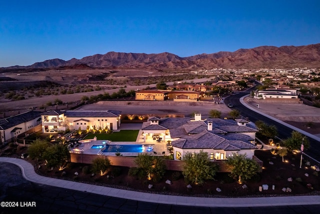 exterior space featuring a patio area, a fenced backyard, and a mountain view