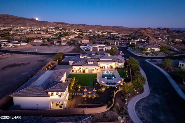 drone / aerial view with a residential view and a mountain view