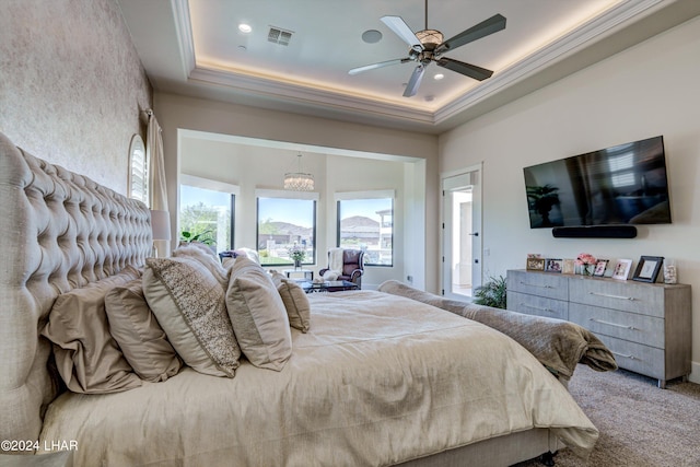 bedroom with ceiling fan, carpet, a raised ceiling, and visible vents