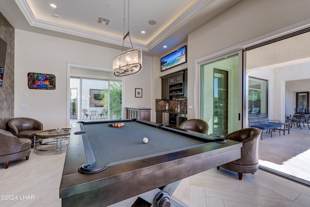 game room with a community bar, visible vents, ornamental molding, a tray ceiling, and recessed lighting