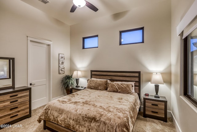 bedroom featuring a ceiling fan, carpet, visible vents, and baseboards