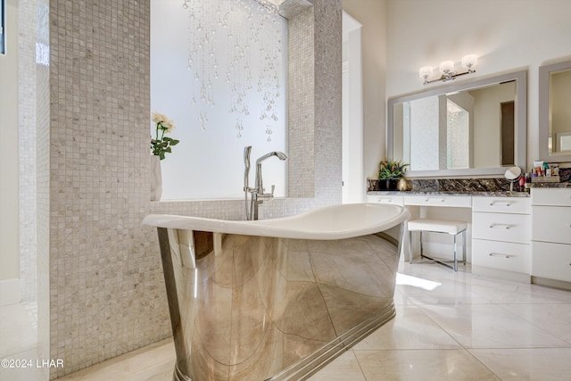 bathroom featuring a soaking tub and vanity