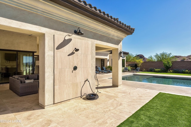 view of pool with a patio, fence, and a fenced in pool