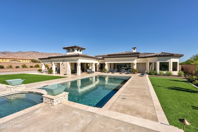 view of pool with a patio, a lawn, and a fenced in pool