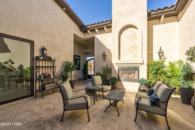 view of patio / terrace featuring an outdoor living space with a fireplace