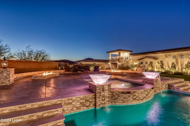 view of pool featuring an outdoor fire pit, a patio area, fence, and a fenced in pool