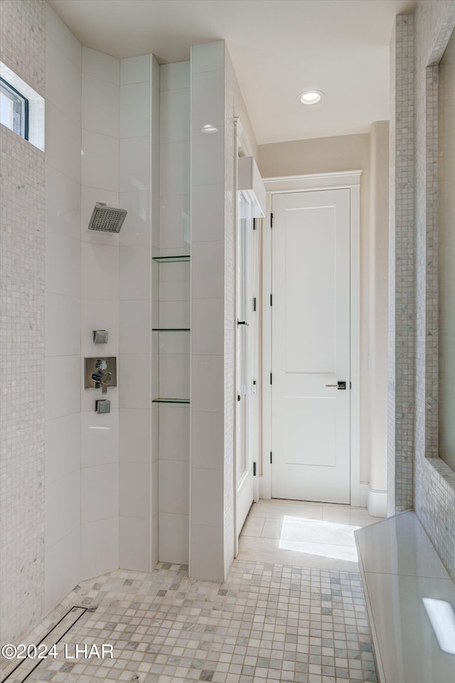 full bath featuring tile patterned floors, a tile shower, and recessed lighting