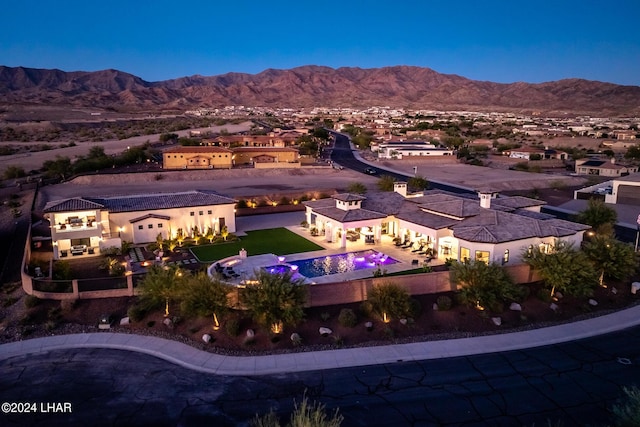 birds eye view of property featuring a mountain view