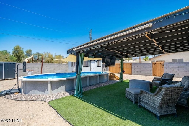 view of swimming pool featuring a fenced in pool and a fenced backyard