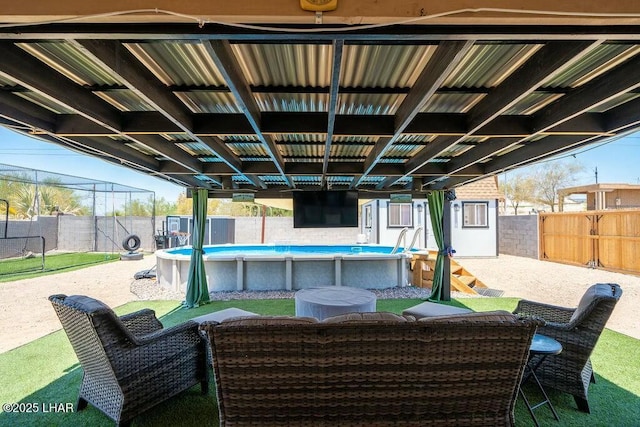 view of patio / terrace with a fenced in pool and a fenced backyard