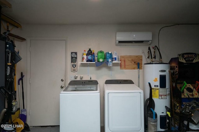 laundry room featuring water heater, laundry area, independent washer and dryer, and a wall mounted air conditioner