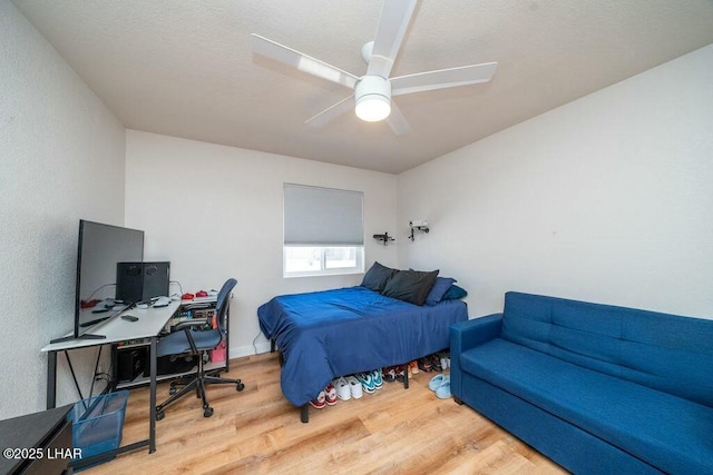 bedroom featuring ceiling fan and wood finished floors