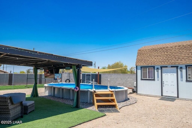 view of swimming pool with a fenced in pool and fence