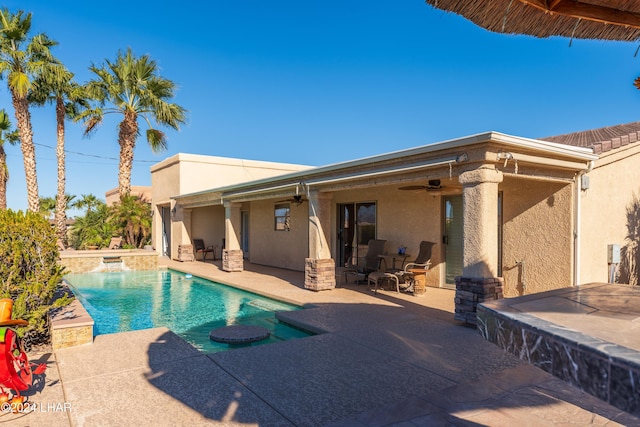 pool featuring a patio area and a ceiling fan