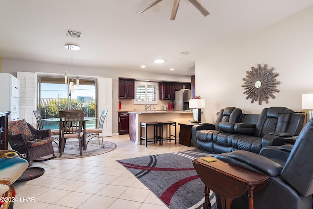 living room with recessed lighting, visible vents, ceiling fan, and light tile patterned floors