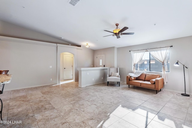 living room with lofted ceiling, light tile patterned floors, and ceiling fan