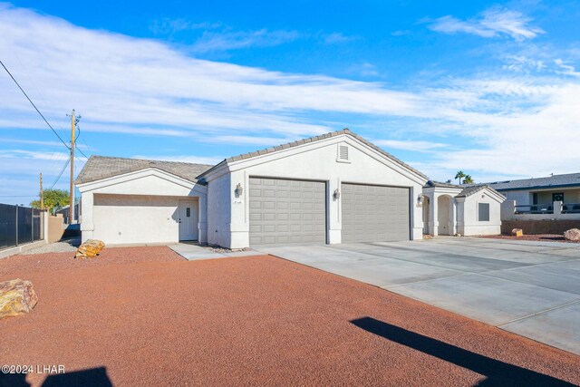 single story home featuring a garage