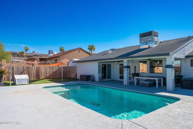 view of pool featuring ceiling fan, central AC unit, and a patio