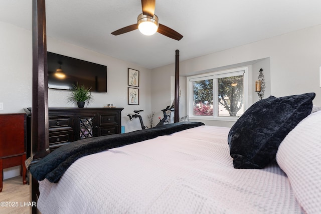 bedroom with ceiling fan and light wood-type flooring