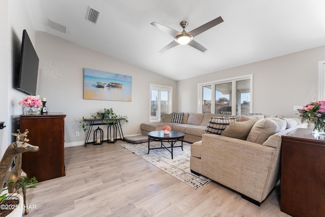 living room with lofted ceiling, light hardwood / wood-style flooring, and ceiling fan