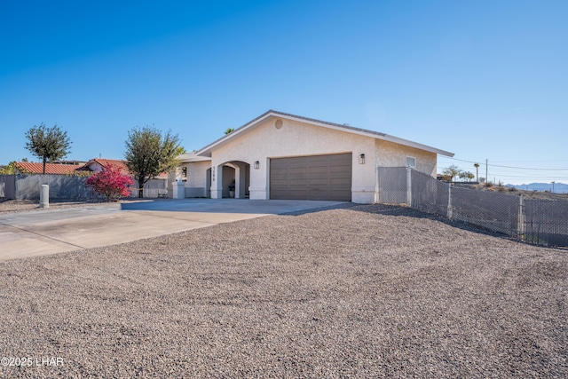 single story home featuring a garage