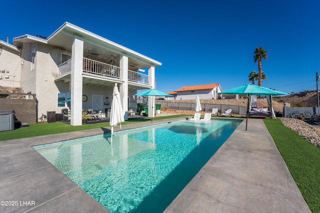 view of pool featuring a patio and ceiling fan