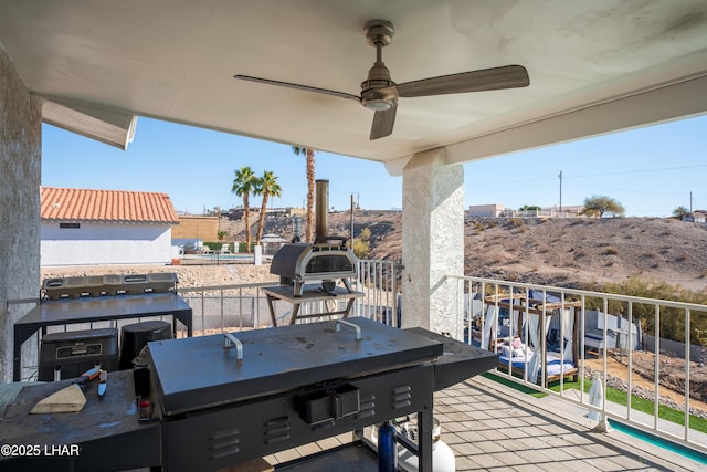 exterior space featuring ceiling fan