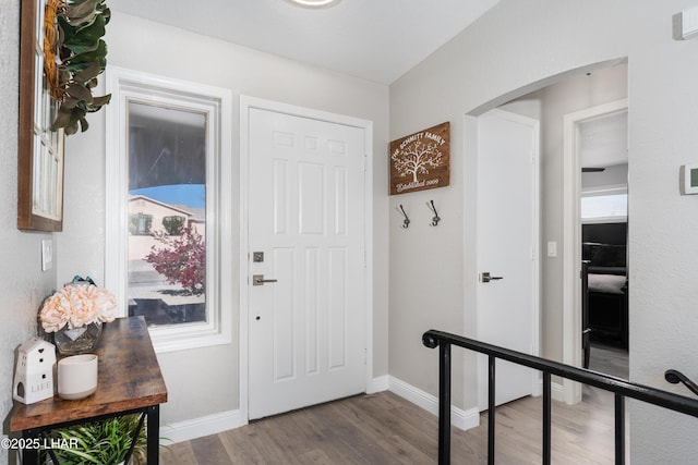 entryway with hardwood / wood-style floors