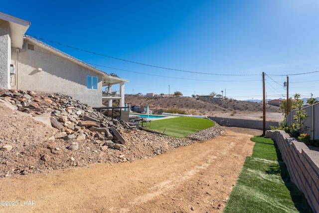 view of yard with a fenced in pool