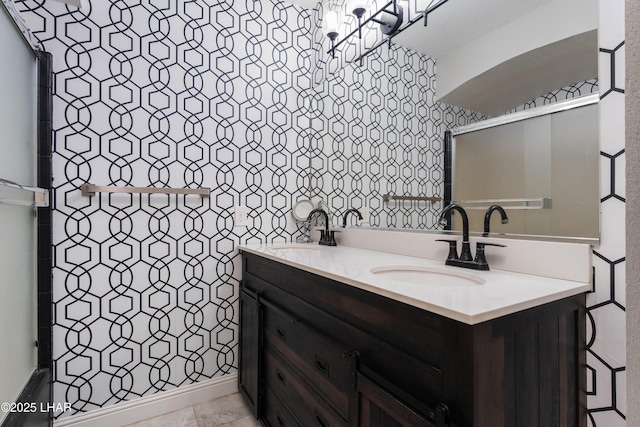 bathroom with tile patterned floors and vanity