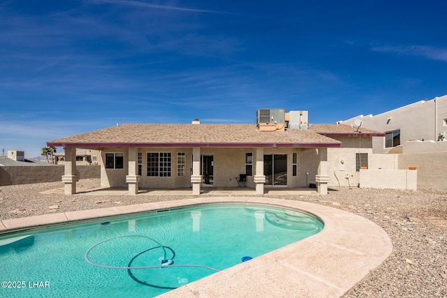 pool featuring a fenced backyard and a patio