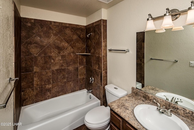 full bath featuring visible vents, a textured wall, toilet, tub / shower combination, and vanity