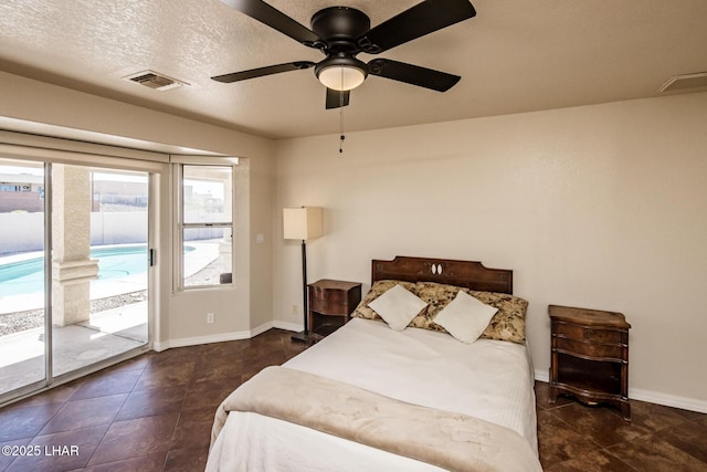 tiled bedroom with a textured ceiling, access to outside, visible vents, and baseboards