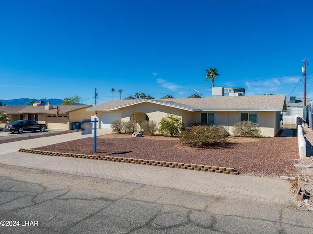 single story home featuring a garage