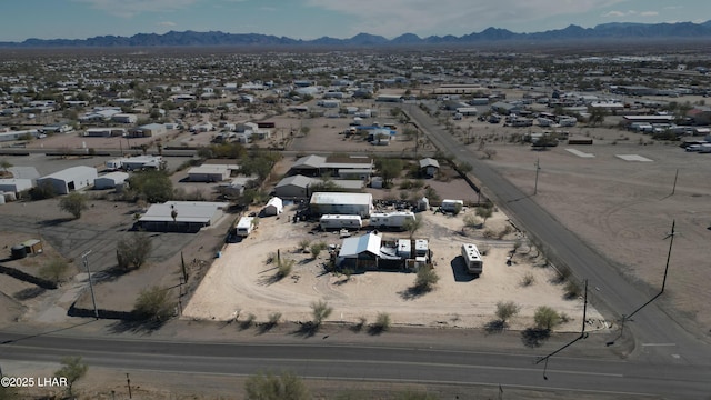 birds eye view of property featuring a mountain view