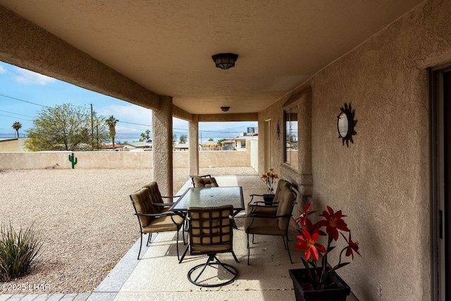 view of patio with a fenced backyard and outdoor dining space