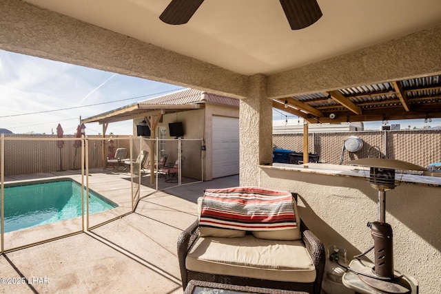 view of swimming pool with a patio area and ceiling fan